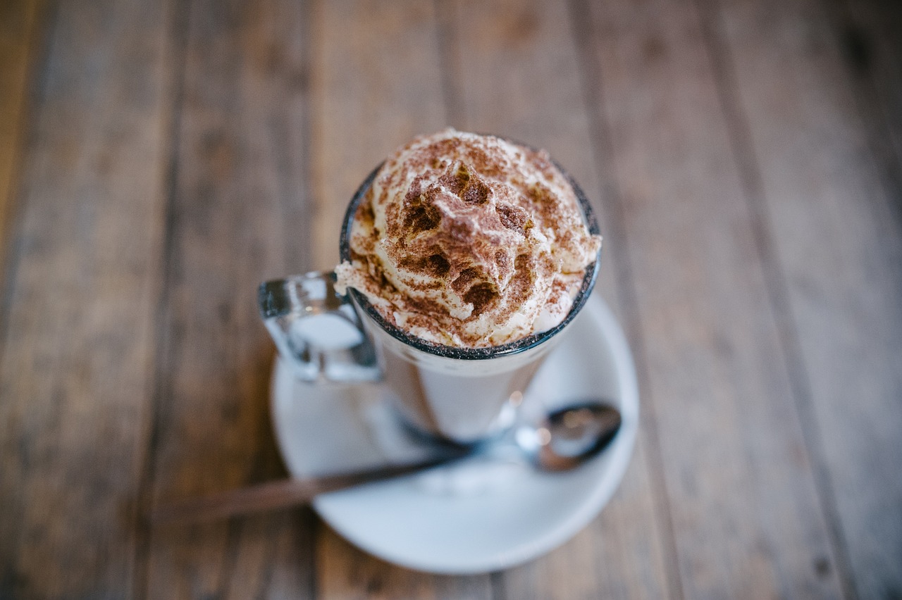 Small esspresso with whipped cream and chocolate shavings